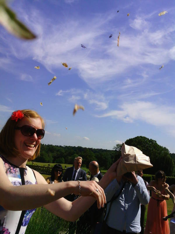 bride and groom showered in confetti